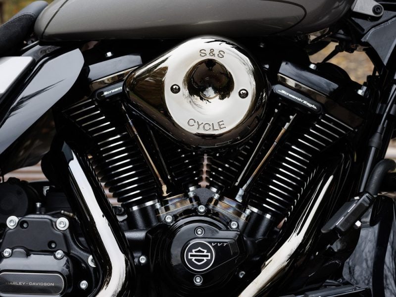 Shiny motorcycle engine with "S&S Cycle" branding, showcasing Harley-Davidson V-Twin engine for motorcycle enthusiasts.