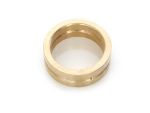 Gold motorcycle bearing spacer for Revelry Motorcycles, durable high-quality motorcycle parts.