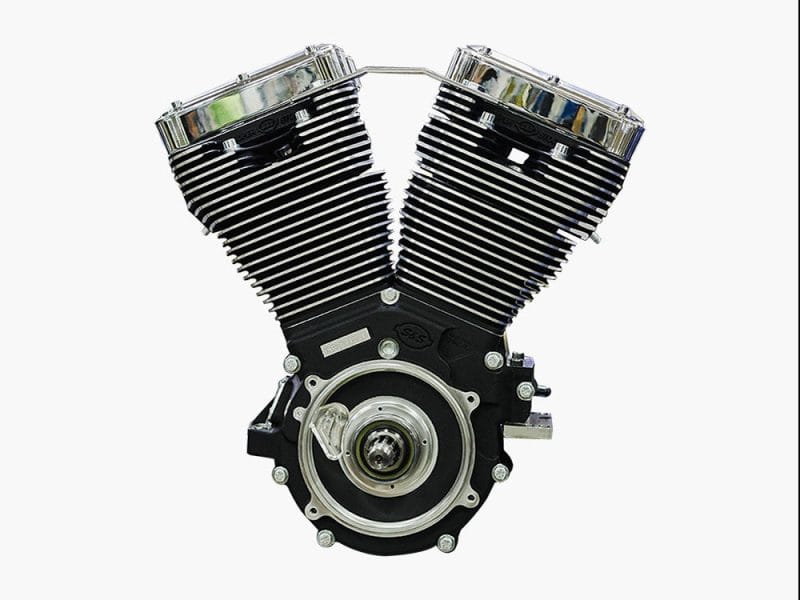 V-twin motorcycle engine with chrome fins and black casing, perfect for custom motorbikes.
