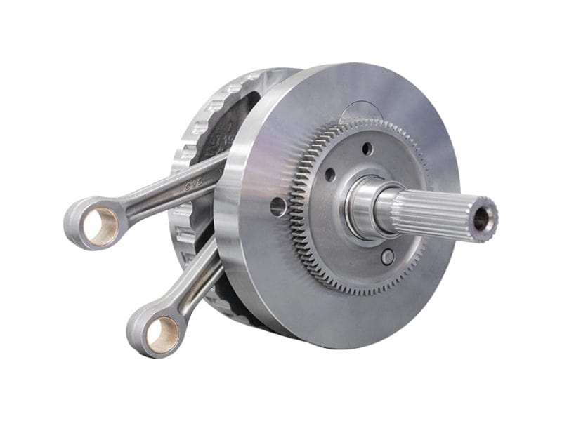 High-performance motorcycle engine crankshaft with pistons for Revelry Cycles.