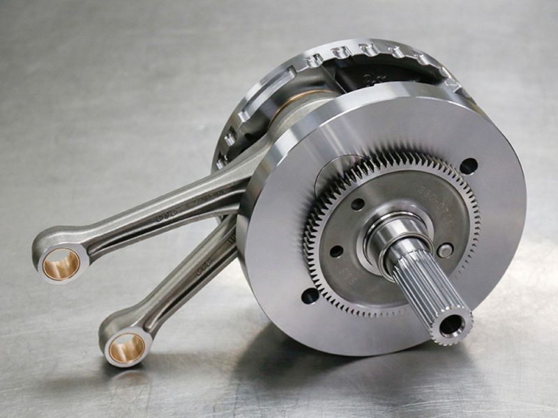 High-performance motorcycle crankshaft with connecting rods for Revelry Motorcycles.