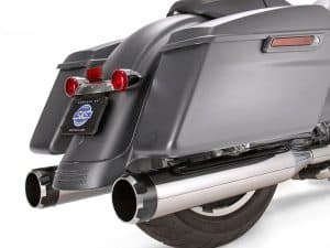 Sleek black motorcycle saddlebags with chrome exhaust pipes, ideal for Harley-Davidson touring bikes.