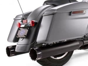 Sleek black Harley Davidson motorcycle exhaust system with saddlebags and tail lights.