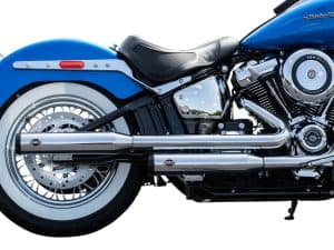 Sleek blue Harley-Davidson motorcycle with chrome exhaust and whitewall tyres.