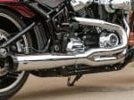 High-performance Harley-Davidson motorcycle engine with chrome exhaust system, perfect for enthusiasts.