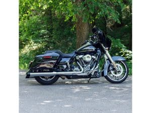 Black touring motorcycle with saddlebags at Revelry Motorcycles, ideal for long rides and adventure.