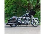 Black touring motorcycle with saddlebags and fairing, ideal for long-distance riding.