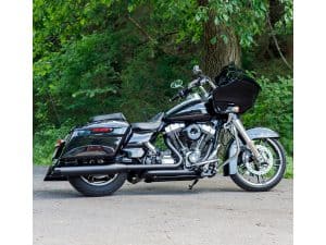 Black touring motorcycle with saddlebags and fairing, ideal for long-distance riding.