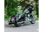 Vivid black touring motorcycle with chrome accents, perfect for scenic rides and long-distance travel.