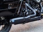High-performance black motorcycle exhaust pipe with Revelry Motorcycles branding, designed for Australian riders.