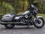 Harley Davidson touring motorcycle in silver with black accents, ideal for long-distance rides and style.
