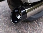 Sleek black motorcycle exhaust pipe with chrome finish for Revelry Motorcycles Australia.