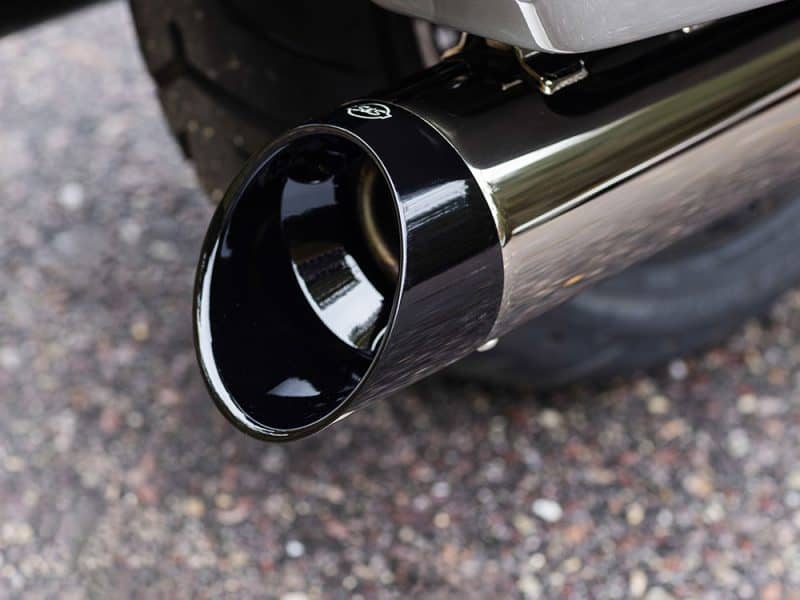 Sleek black motorcycle exhaust pipe with chrome finish for Revelry Motorcycles Australia.