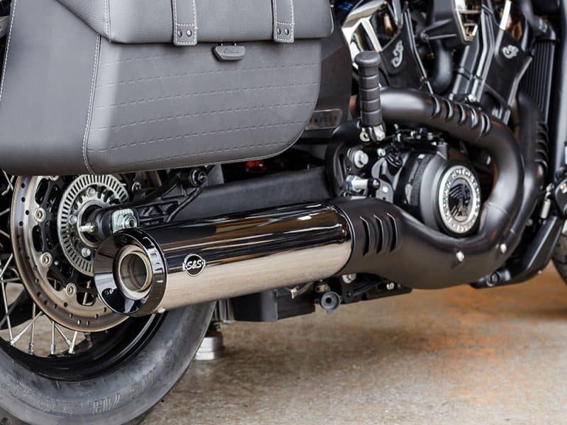 High-performance motorcycle exhaust system with sleek black and chrome finish.