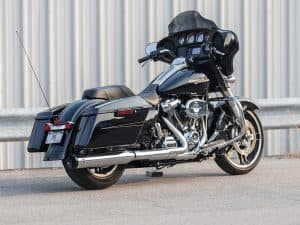 Harley-Davidson touring motorcycle with black finish and chrome accents in pristine condition.