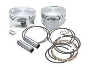 High-performance motorcycle piston set with connecting rods and piston rings from Revelry Motorcycles.