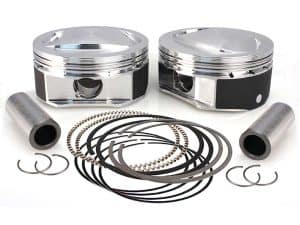 Piston kit with connecting rods, rings, and bearings for motorcycle engine rebuilds.