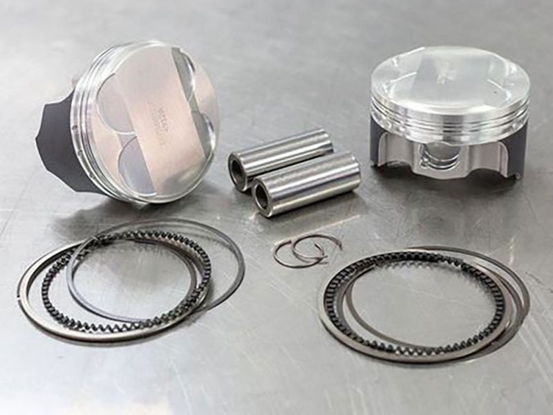 Engine piston and internal components for motorcycle rebuilds, high-performance parts by Revelry Motorcycles.