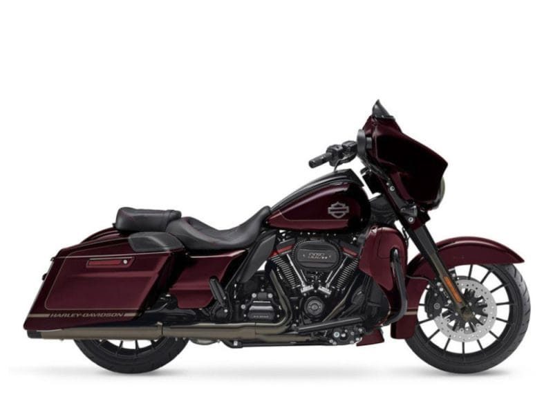 Sleek maroon Harley-Davidson touring motorcycle with custom features for long-distance cruising.