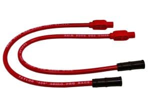Red spark plug ignition lead for motorcycle racing.