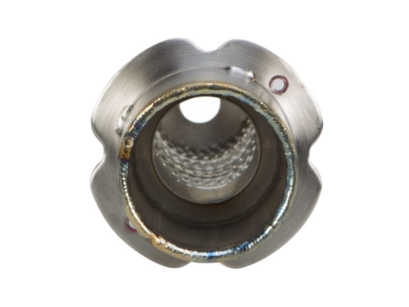 High-performance motorcycle exhaust fitting with precision welds for Revelry Motorcycles.