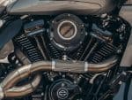 V-twin motorcycle engine with black and chrome components, detailed close-up shot.