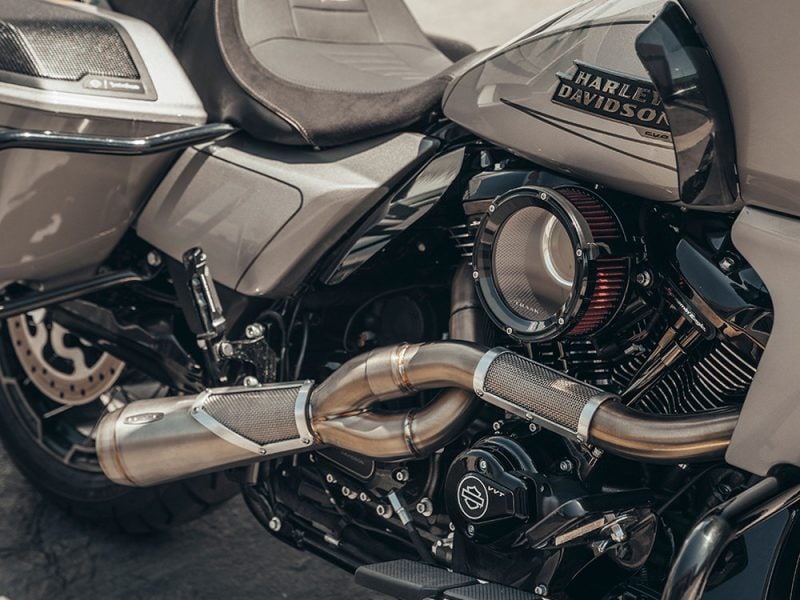 Harley Davidson motorcycle engine with custom exhaust, showcasing high-performance motorcycle upgrades.