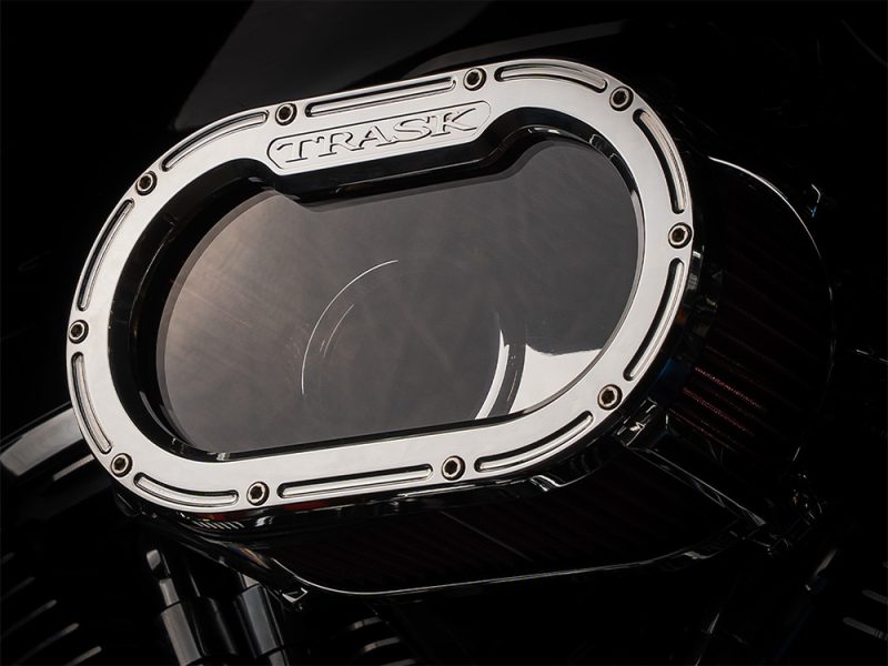 High-performance motorcycle air filter with "TRASK" branding for enhanced engine airflow and power.