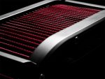 High-performance motorcycle radiator with red cooling fins and aluminium frame.