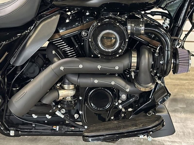 Tornado Turbo Kit - Black Exhaust V-twin motorcycle engine featuring custom exhaust system and performance air filter.