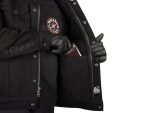 Heavy black motorcycle jacket with Thrasher patch and leather gloves, casual riding gear.