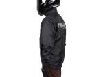 Reflective black motorcycle jacket with Thraphy logo for motorcycle riding, made from durable textile material.