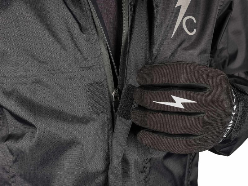Motorcycle rider wearing Revelry branded gloves and jacket, motorcycle apparel, riding gear, adventure riding equipment.