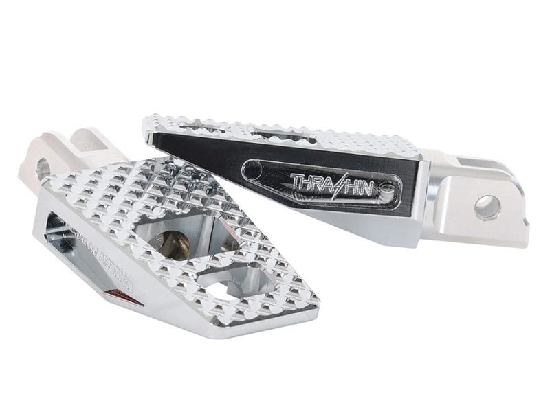 Lightweight aluminium motorcycle foot pegs for enhanced grip and control.