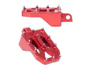 Red aluminium motorcycle foot pegs with premium traction for Revelry Motorcycles Australia.