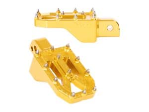 Bright yellow motorbike foot pegs with metal spikes for Revelry Motorcycles.