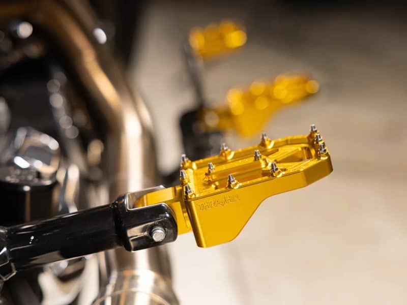High-quality yellow motorcycle footpeg for Revelry Motorcycles, durable and stylish for enhanced riding performance.