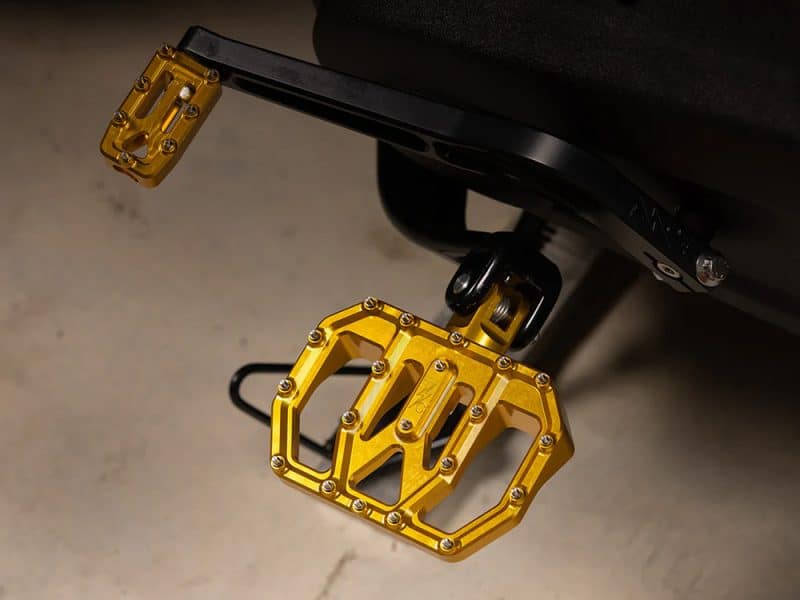 Bright gold motorcycle pegs for Revelry Motorcycles, durable aluminium construction.