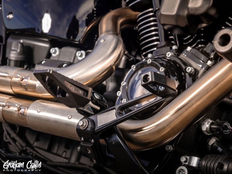 High-performance motorcycle engine with custom exhaust pipes - Revelry Motorcycles Sydney.