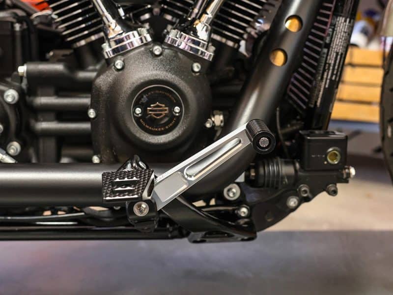 High-performance Harley-Davidson motorcycle engine close-up, showcasing custom black and chrome details.
