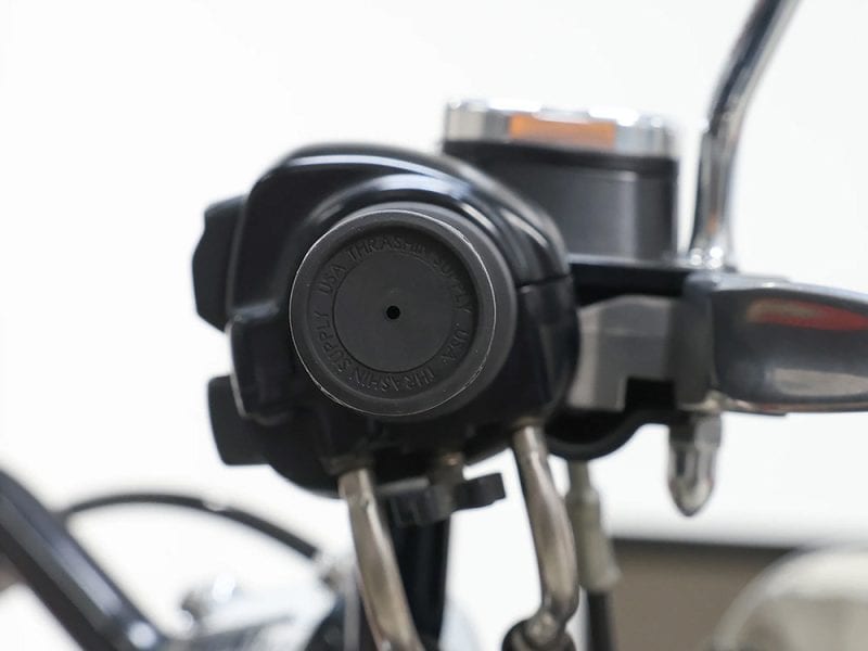 High-performance motorcycle brake fluid reservoir with cap, perfect for Revelry Motorcycles riding gear.