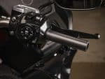 Handlebar controls on a motorcycle at Revelry Cycles, showcasing premium riding accessories and gear in Australia.