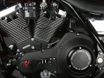 V-Twin motorcycle engine with black and chrome finish, featuring Revelry Cycles design elements.