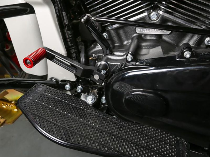 High-performance motorcycle footpeg and engine detail at Revelry Motorcycles in Australia.