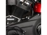 Harley-Davidson motorcycle engine close-up, black and red colour scheme, high-performance cruiser bike.