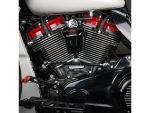 V8 motorcycle engine with chrome fins and red accents, showcasing high-performance customisation.
