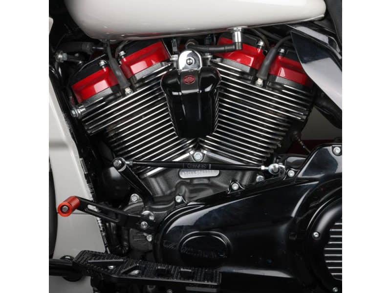 V8 engine detail on a black and red Revelry Motorcycles cruiser bike, showcasing expert craftsmanship and high-performance parts.