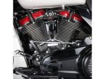 V-twin motorcycle engine with chrome fins and red accents, showcasing high-performance motorcycle parts.