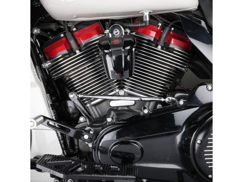 V-twin motorcycle engine with chrome fins and red accents, showcasing high-performance motorcycle parts.