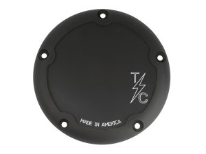 Black motorcycle coil cover with 'TLC' logo and 'Made in America' text for Revelry Motorcycles.